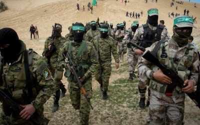 Members of the Izz ad-Din al-Qassam Brigades, the military wing of the Palestinian Islamist movement Hamas, attend a memorial in the southern Gaza Strip town of Rafah on January 31, 2017. (Abed Rahim Khatib/Flash90)