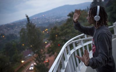 A hip hop instructor who goes by the stage name of "Poppin Chris" dances on the roof of Impact Hub in Kigali, Rwanda, on February 15, 2017. (Miriam Alster/Flash90)