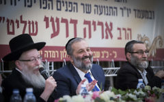 Interior Minister Aryeh Deri (C), Deputy Health Minister Yaakov Litzman (L) and United Torah Judaism MK Moshe Gafni attend a Shas party conference at the Ramada Hotel in Jerusalem on February 16, 2017. (Yonatan Sindel/Flash90)