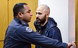 Nadav Sela, suspected of murdering his wife, his two children and a neighbor's son in the Northern town of Migdal, seen at the Magistrate's Court in Nazareth on February 26, 2017 (Basel Awidat/Flash90)