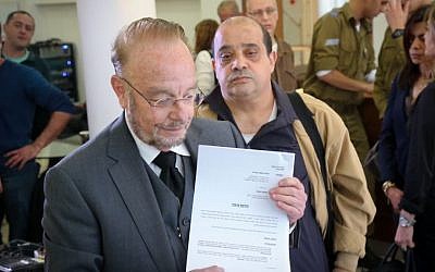 Yoram Sheftel, defense attorney for convicted manslaughterer Elor Azaria, and Azaria's father Charlie speak at a press conference on March 1, 2017 appealing Elor's jail sentence. (FLASH90)