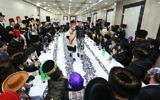 Ultra-Orthodox Jewish men from the chassidic dynasty of Vizhnitz-Kosov celebrating the Jewish festival of Purim, in Beit Shemesh, March 11, 2017. (Yaakov Lederman/Flash90)