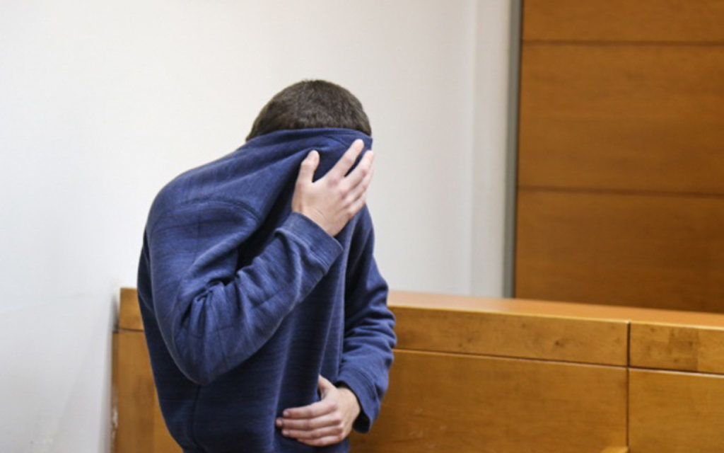 A man brought for a court hearing at the Rishon Lezion Magistrate's Court, under suspicion of issuing fake bomb threats against Jewish institutions around the world, March 23, 2017. (Flash90)