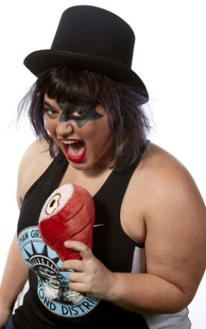 Dara Fineman pictured holding a piece of ham. (Jean Schwarzwalder/JTA)