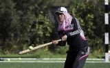 In this Sunday, March 19, 2017 photo, Palestinian coach, Mahmoud Tafesh, gives instructions before starting training for an all women's baseball game, on a soccer field in Khan Younis, southern Gaza Strip. (AP Photo/Khalil Hamra)