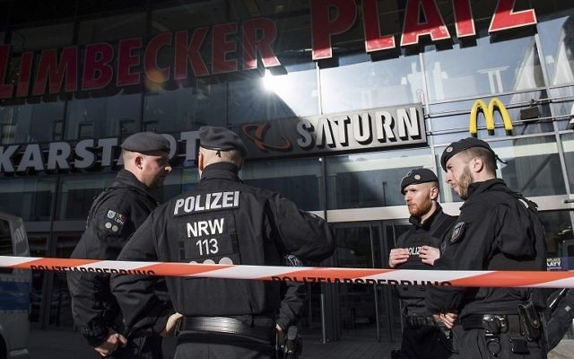 Policemen in front of a shopping mall in Essen, Germany, Saturday, March 11, 2017. (Bernd Thissen/dpa via AP)