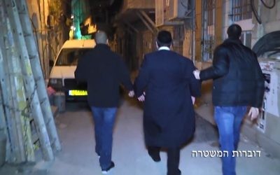 Screen capture from video showing police arresting ultra-Orthodox men on suspicion of sex crimes against women and children, March 27, 2017. (Police spokesperson)