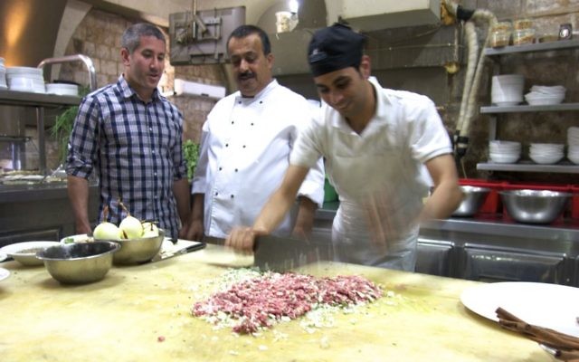 Chef Michael Solomonov (left) visits chef Husam Abbas (center) at his El Babor restaurant at Umm al-Fahm to learn how he makes his signature kebab El Babor dish. (Florentine Films) Chef Michael Solomonov (left) visits chef Husam Abbas (center) at his El Babor restaurant at Umm al-Fahm to learn how he makes his signature kebab El Babor dish. (Florentine Films)