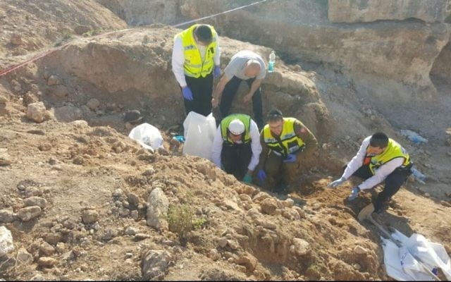ZAKA rescue workers uncover the remains of soldiers in the East Jerusalem village of Sur Baher on March 9, 2017. (Nati Shapiro, ZAKA Search and Rescue) ZAKA rescue workers uncover the remains of soldiers in the East Jerusalem village of Sur Baher on March 9, 2017. (Nati Shapiro, ZAKA Search and Rescue)