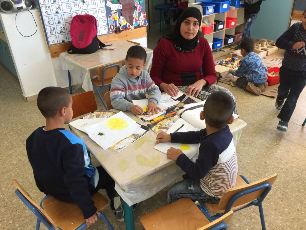 Working on artwork related to Malak Farooge's Lantern Library book, ' Where Do I Go When I Am Angry' at the Lod kindergarten (Jessica Steinberg/Times of Israel)