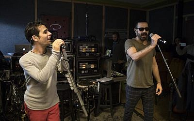 Iranian Shahin Najafi, right, and Israeli Aviv Geffen rehearse in Tel Aviv on February 27, 2017. (AP/Dan Balilty)
