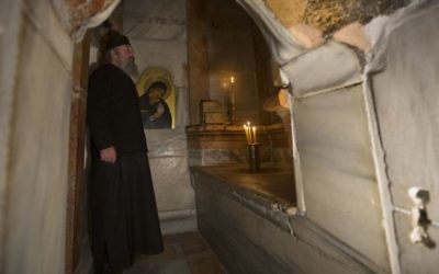 A Greek priest stands inside the renovated Edicule in the Church of the Holy Sepulchre, traditionally believed to be the site of the crucifixion of Jesus, in Jerusalem's Old City Monday, Mar. 20, 2017. (AP /Sebastian Scheiner) A Greek priest stands inside the renovated Edicule in the Church of the Holy Sepulchre, traditionally believed to be the site of the crucifixion of Jesus, in Jerusalem's Old City Monday, Mar. 20, 2017. (AP /Sebastian Scheiner)