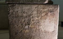 An ossuary with an inscription of Hebrew letters forming the word "Yeshua", or Jesus, is stored in Israel's antiquities authority storeroom, in Beit Shemesh, March 19, 2017. Israel's antiquities authority opened up its vast storeroom to reporters Sunday for a peek at select artifacts from the time of Jesus. Experts say they have yet to find direct archaeological evidence of the Jewish preacher who died on the cross and changed the course of history. (AP Photo/Tsafrir Abayov)