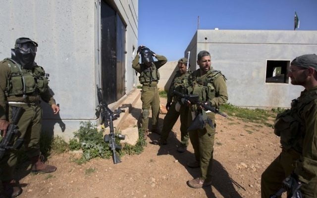 In this Wednesday, March 29, 2017 photo, Israeli soldiers train with paintball guns during a drill at an Army base near Elyakim, Israel. (AP/Sebastian Scheiner) In this Wednesday, March 29, 2017 photo, Israeli soldiers train with paintball guns during a drill at an Army base near Elyakim, Israel. (AP/Sebastian Scheiner)