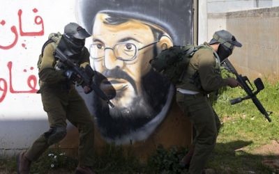 In this Wednesday, March 29, 2017 photo, Israeli soldiers train with paintball guns during a drill at an Army base near Elyakim, Israel. (AP Photo/Sebastian Scheiner)