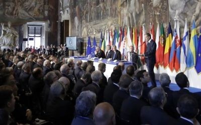 European Council President Donald Tusk, panel right, speaks to EU leaders during an EU summit meeting at the Orazi and Curiazi Hall in the Palazzo dei Conservatori in Rome on Saturday, March 25, 2017 (AP Photo/Alessandra Tarantino)