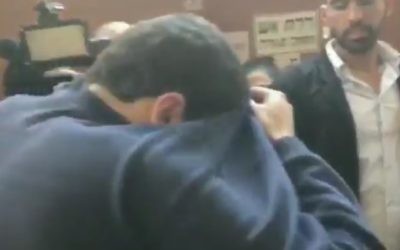 The Israeli-American teenager suspected of making hundreds of fake bomb threats to JCCs and other Jewish institutions in the US and elsewhere leaves the Rishon Lezion Magistrate's Court on Thursay, March 23, 2017, where his remand was extended for 8 days. (Screenshot/Channel 10)