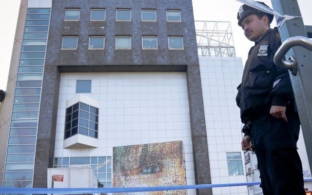 A police officer stands outside the Jewish Children's Museum following a bomb threat, Thursday March 9, 2017 in Brooklyn borough of New York. (AP /Bebeto Matthews) A police officer stands outside the Jewish Children's Museum following a bomb threat, Thursday March 9, 2017 in Brooklyn borough of New York. (AP /Bebeto Matthews)
