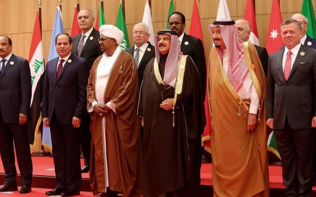 A section of twenty one kings, presidents and top officials from the Arab League summit pose for a group photo, at a gathering near the Dead Sea in Jordan on Wednesday, March 29, 2017. (AP Photo/ Raad Adayleh)
