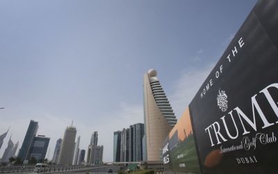 In this Saturday, Feb. 18, 2017 file photo, a giant billboard advertising the Trump International Golf Club hangs at the Dubai Trade Center roundabout, in Dubai, United Arab Emirates. (AP Photo/Kamran Jebreili, File)