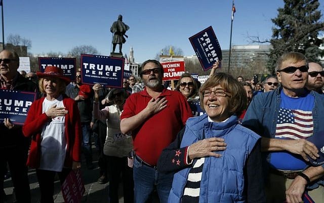 Supporters of US President Donald Trump gather during a March 4 Trump rally on the state Capitol steps in Denver, Colorado, Saturday, March 4, 2017. (AP Photo/Brennan Linsley)