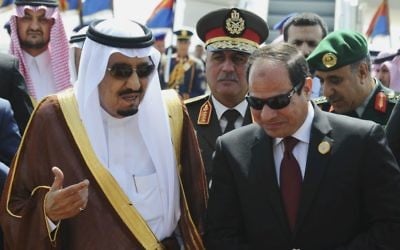 In this March 28, 2015 photo, provided by Egypt's state news agency MENA, Egyptian President Abdel-Fattah el-Sissi, right, talks with Saudi King Salman after the king arrived in Sharm el-Sheikh, Egypt. (MENA via AP,)