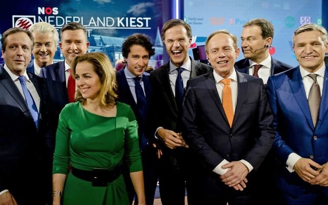 Democrats 66 party leader Alexander Pechtold, right-wing populist leader Geert Wilders, Socialist Party leader Emile Roemer, Party for the Animals' Marianne Thieme, Green Left party leader Jesse Klaver, Dutch Prime Minister Mark Rutte, Cornelis Gerrit (Kees) van der Staaij, Labour Party leader Lodewijk Asscher, and Christan Democrats party leader Sybrand Buma, from left, pose for a picture after the closing debate at parliament in The Hague, Netherlands, Tuesday, March 14, 2017. (Robin van Lonkhuijsen ANP POOL via AP) Democrats 66 party leader Alexander Pechtold, right-wing populist leader Geert Wilders, Socialist Party leader Emile Roemer, Party for the Animals' Marianne Thieme, Green Left party leader Jesse Klaver, Dutch Prime Minister Mark Rutte, Cornelis Gerrit (Kees) van der Staaij, Labour Party leader Lodewijk Asscher, and Christan Democrats party leader Sybrand Buma, from left, pose for a picture after the closing debate at parliament in The Hague, Netherlands, Tuesday, March 14, 2017. (Robin van Lonkhuijsen ANP POOL via AP)