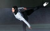 In this undated image provided by Nike, figure skater Zahra Lari models Nike's new hijab for Muslim female athletes. (Nike via AP)