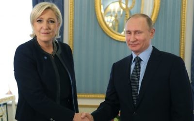 Russian President Vladimir Putin, right, shakes hands with French far-right presidential candidate Marine Le Pen, in the Kremlin in Moscow, Russia, March 24, 2017. (Mikhail Klimentyev, Sputnik, Kremlin Pool Photo via AP)