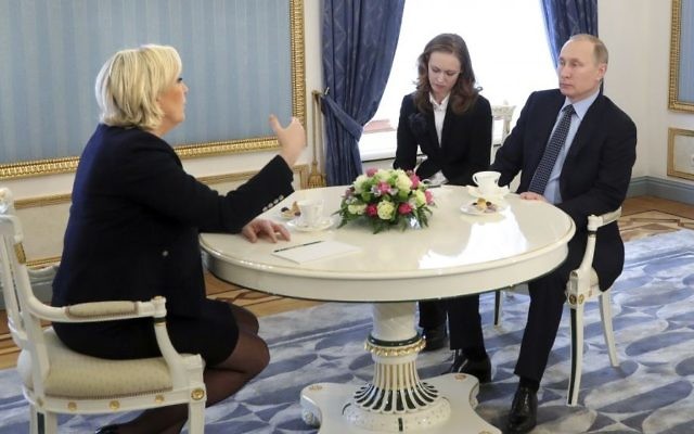 French far-right presidential candidate Marine Le Pen, left, gestures while speaking to Russian President Vladimir Putin, right, during their meeting in the Kremlin in Moscow, Russia, on Friday, March 24, 2017. (Mikhail Klimentyev/Sputnik, Kremlin Pool Photo via AP) French far-right presidential candidate Marine Le Pen, left, gestures while speaking to Russian President Vladimir Putin, right, during their meeting in the Kremlin in Moscow, Russia, on Friday, March 24, 2017. (Mikhail Klimentyev/Sputnik, Kremlin Pool Photo via AP)