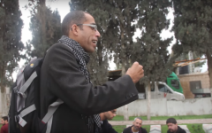 Basel al-A'araj, who was killed in a gunfire exchange with Israeli troops on March 6, 2017, speaks in front of a group at a cemetery in Qabatiya, in the northern West Bank, on December 19, 2014. (Screen capture: YouTube)
