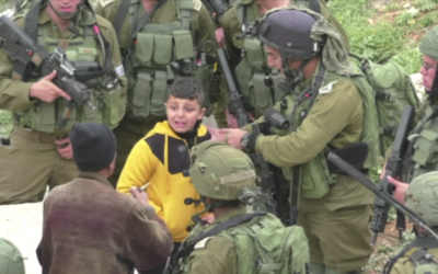A Palestinian boy being led through the streets of Hebron, whom the army says is suspected of throwing a firebomb at a Jewish settlement, on March 21, 2017. (Screen capture: B'Tselem) A Palestinian boy being led through the streets of Hebron, whom the army says is suspected of throwing a firebomb at a Jewish settlement, on March 21, 2017. (Screen capture: B'Tselem)