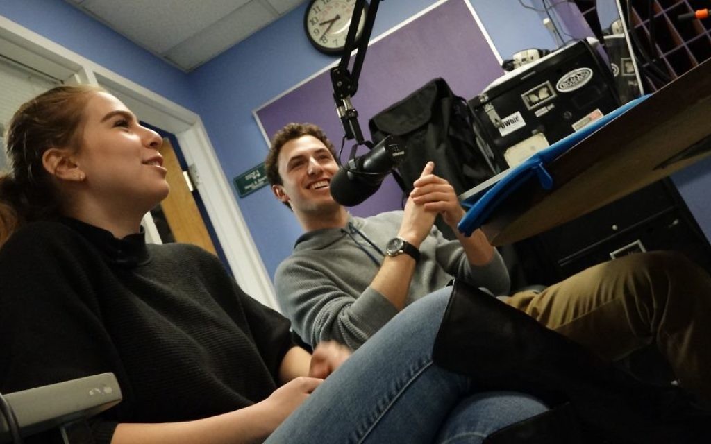 Shai Wallach (left) and Elie Fenyes chat about their studies and interests on Radio Gesher. (Dana Wachter/Times of Israel) Shai Wallach (left) and Elie Fenyes chat about their studies and interests on Radio Gesher. (Dana Wachter/Times of Israel)