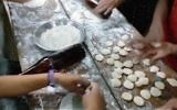Indian Bnei Menashe Jews baking matzah in Churachandpur, India, March 30, 2017. (Courtesy of Shavei Israel)