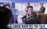 A man watches a TV news program showing an image, published in North Korea's Rodong Sinmun newspaper, of North Korean leader Kim Jong Un at the country's Sohae launch site, at Seoul Railway station in Seoul, South Korea, Sunday, March 19, 2017. (AP Photo/Ahn Young-joon)