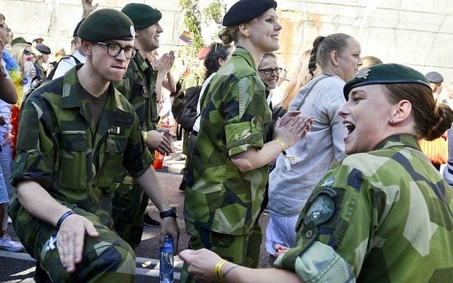 This is a Saturday Aug. 1, 2015 file photo of Swedish Army personnel as they take part in the annual Gay Pride Parade in Stockholm. (Vilhelm Stokstad/TT, File via AP)
