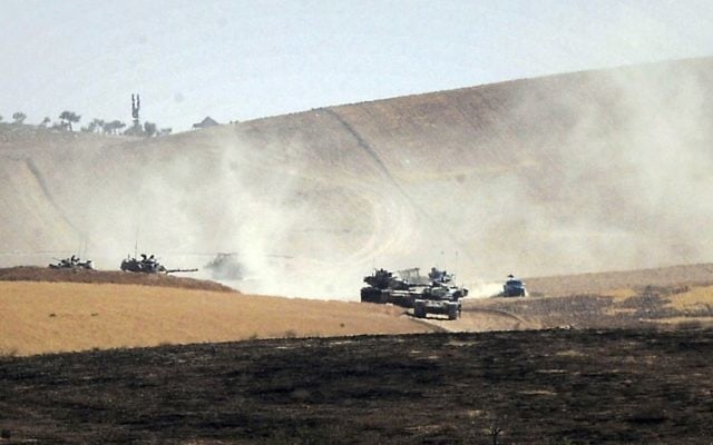 In this August 26, 2016, file photo, the Turkish military moves inside Syria near the Turkish border town of Karkamis. (Ismail Coskun, IHA via AP, File)