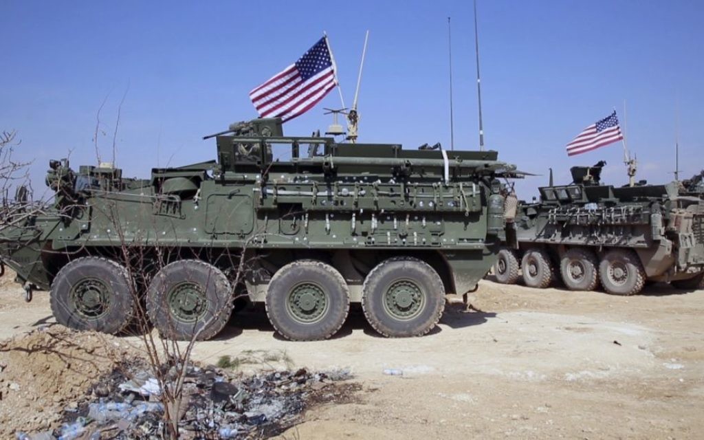 US forces take up positions on the outskirts of the Syrian town, Manbij, a flashpoint between Turkish troops and allied Syrian fighters and U.S.-backed Kurdish fighters, in al-Asaliyah village, Aleppo province, Syria, March 7, 2017. (Arab 24 network, via AP)