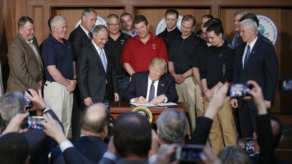 President Donald Trump, accompanied by Environmental Protection Agency (EPA) Administrator Scott Pruitt, third from left, and Vice President Mike Pence, right, signs an Energy Independence Executive Order, March 28, 2017, at EPA headquarters in Washington. (AP Photo/Pablo Martinez Monsivais) President Donald Trump, accompanied by Environmental Protection Agency (EPA) Administrator Scott Pruitt, third from left, and Vice President Mike Pence, right, signs an Energy Independence Executive Order, March 28, 2017, at EPA headquarters in Washington. (AP Photo/Pablo Martinez Monsivais)