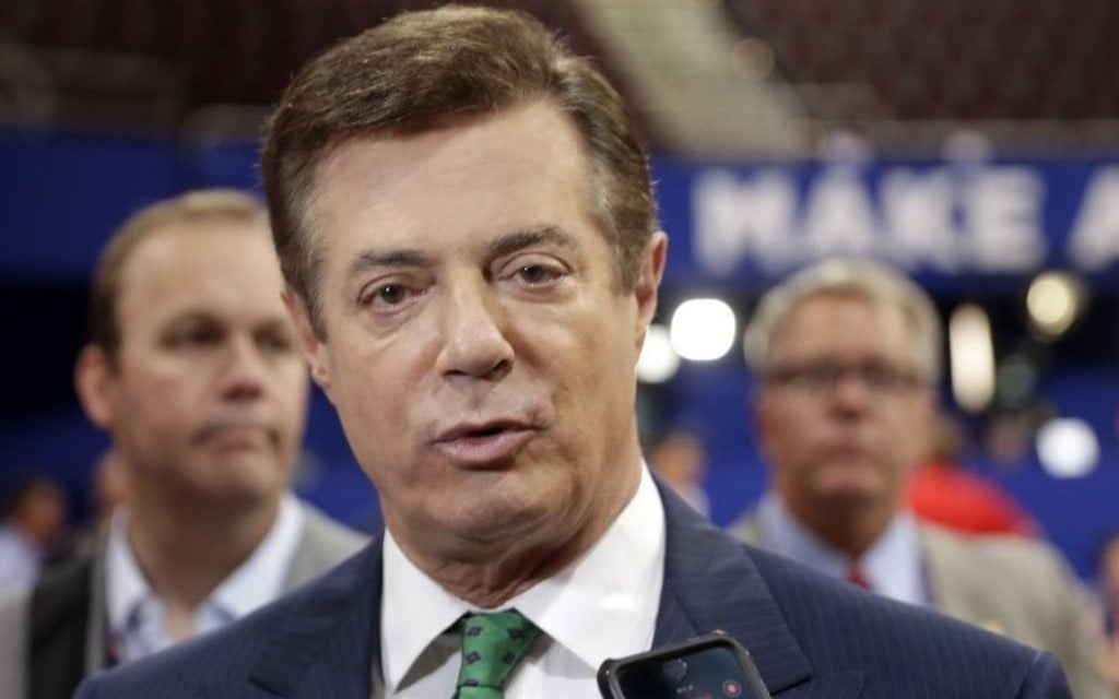 Former Trump campaign chairman Paul Manafort talks to reporters on the floor of the Republican National Convention at Quicken Loans Arena in Cleveland, July 17, 2016. (AP/Matt Rourke)