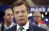 Former Trump campaign chairman Paul Manafort talks to reporters on the floor of the Republican National Convention at Quicken Loans Arena in Cleveland, July 17, 2016. (AP/Matt Rourke)