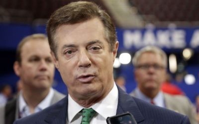 Former Trump campaign chairman Paul Manafort talks to reporters on the floor of the Republican National Convention at Quicken Loans Arena in Cleveland, July 17, 2016. (AP/Matt Rourke)