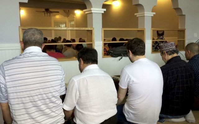 In this Friday, March 10, 2017 photo, men gather for afternoon prayers at the Muslim Association of Hawaii in Honolulu. (AP Photo/Cathy Bussewitz) In this Friday, March 10, 2017 photo, men gather for afternoon prayers at the Muslim Association of Hawaii in Honolulu. (AP Photo/Cathy Bussewitz)