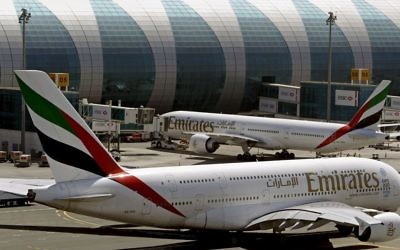 Emirates passenger planes at Dubai airport in United Arab Emirates, on May 8, 2014. (AP Photo/Kamran Jebreili, File)
