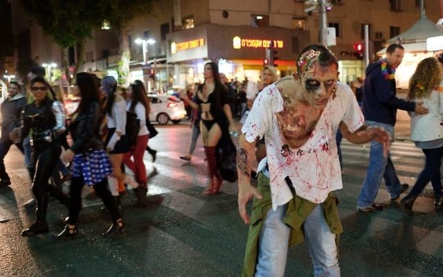 Israelis take part in an annual Zombie Walk ahead of the Jewish holiday of Purim in Tel Aviv, March 11, 2017. (Yaniv Nadav/ Flash90) Israelis take part in an annual Zombie Walk ahead of the Jewish holiday of Purim in Tel Aviv, March 11, 2017. (Yaniv Nadav/ Flash90)
