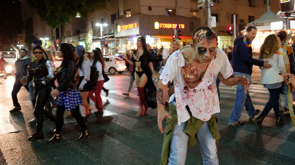 Israelis take part in an annual Zombie Walk ahead of the Jewish holiday of Purim in Tel Aviv, March 11, 2017. (Yaniv Nadav/Flash90) Israelis take part in an annual Zombie Walk ahead of the Jewish holiday of Purim in Tel Aviv, March 11, 2017. (Yaniv Nadav/Flash90)