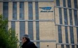 A man walks under the Mobileye logo in Jerusalem, March 13, 2017. (Yonatan Sindel/Flash90)