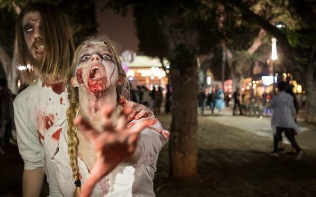 Israelis take part in an annual Zombie Walk ahead of the Jewish holiday of Purim in Tel Aviv, March 11, 2017. (Yaniv Nadav/Flash90) Israelis take part in an annual Zombie Walk ahead of the Jewish holiday of Purim in Tel Aviv, March 11, 2017. (Yaniv Nadav/Flash90)