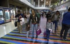Illustrative: In this March 17, 2017 photo, Jewish converts Sahir Quitero, center, her husband Franklin Perez, son Ezra, left, and daughter Hannah, walk to departures lounge of the Simon Bolivar International Airport in Maiquetia, Venezuela, on their way to Israel. (AP Photo/Fernando Llano)