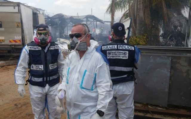Rescue workers at a fireworks factory in the central Israeli village of Porat battle a blaze that killed at least two, wounded seven and damaged nearby homes. (Israel Police)